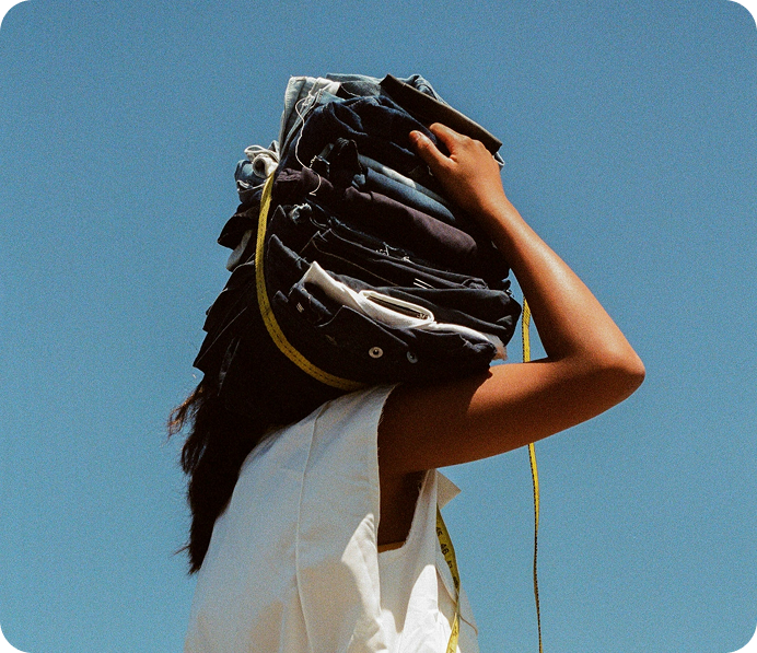 Person holding clothes on head